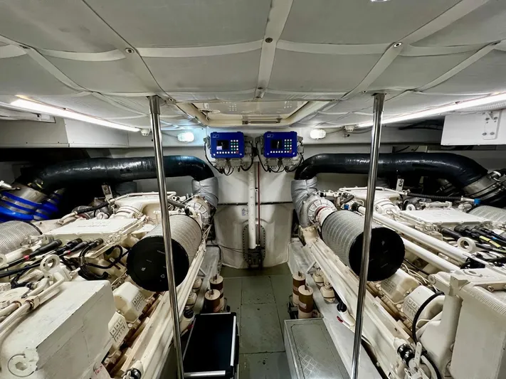  Yacht Photos Pics Engine room of a 2003 Ferretti Yachts 760, showcasing dual engines and control systems.