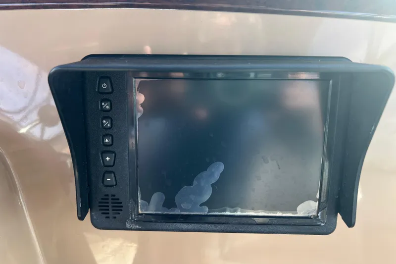 Ne Sea Yacht Photos Pics Control panel of a 2004 Carver 466 MY boat with buttons and screen.