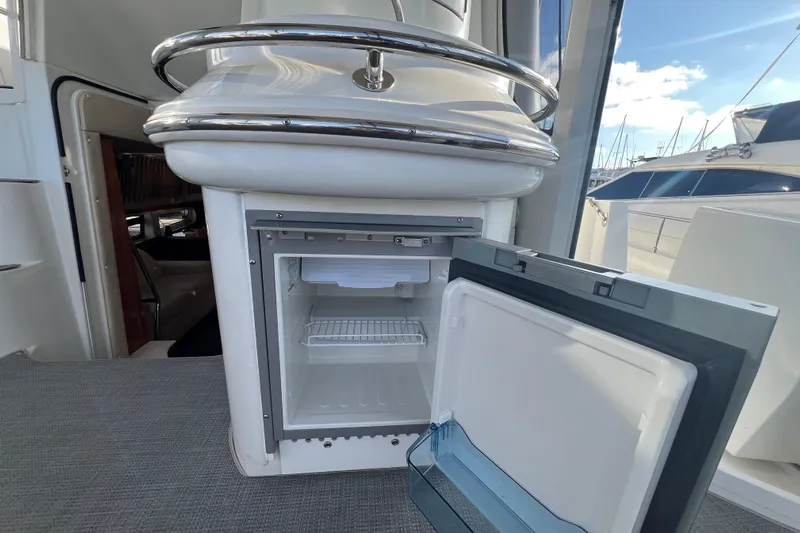 Ne Sea Yacht Photos Pics Open mini fridge on 2004 Carver 466 MY yacht deck, with marina view.