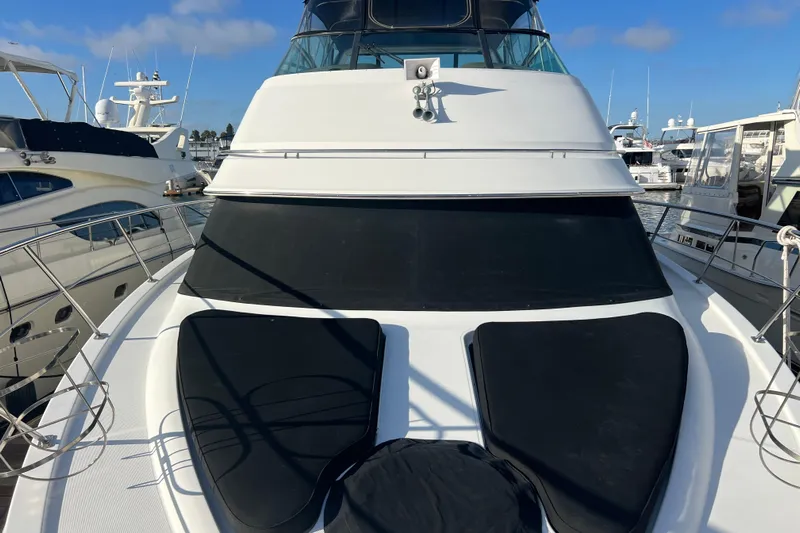 Ne Sea Yacht Photos Pics 2004 Carver 466 MY yacht docked at marina, featuring sleek design and spacious deck.