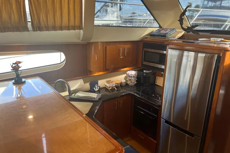 Ne Sea Yacht Photos Pics Luxurious kitchen interior of 2004 Carver 466 MY yacht with modern appliances.