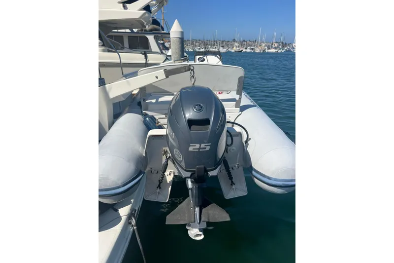 Ne Sea Yacht Photos Pics Inflatable boat with Yamaha 25 outboard motor, docked near Carver 466 Motor Yacht, 2004.