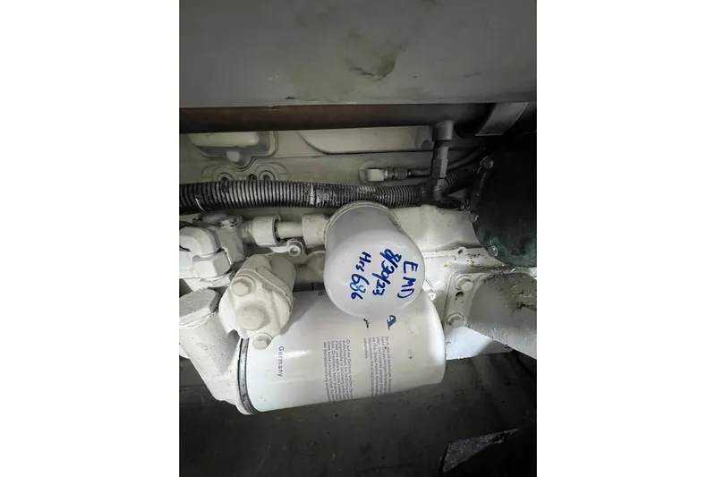 Ne Sea Yacht Photos Pics Engine component of a 2004 Carver 466 MY with visible filter and wiring.