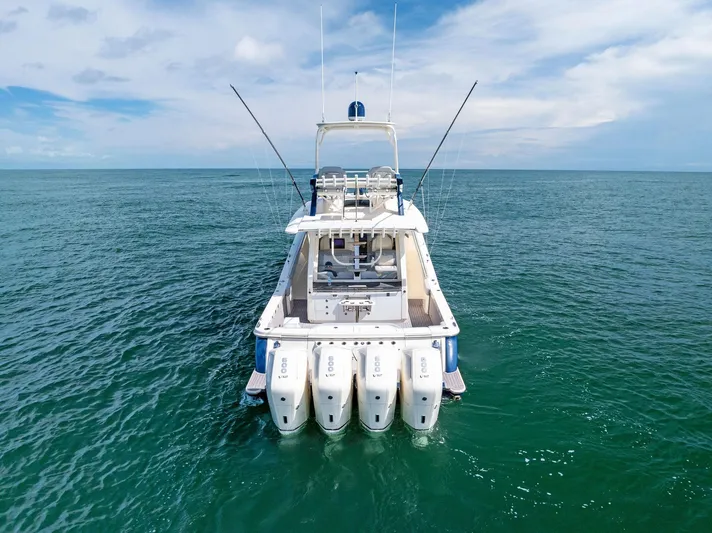 Bottom Line Yacht Photos Pics 2022 Scout LXF boat with four engines on open sea.
