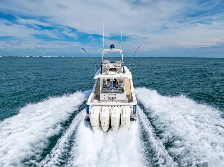 Bottom Line Yacht Photos Pics 2022 Scout LXF boat cruising on open ocean with powerful engines.
