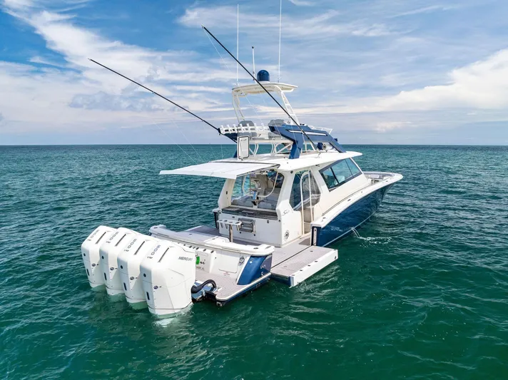 Bottom Line Yacht Photos Pics 2022 Scout LXF boat on open sea with multiple outboard engines.