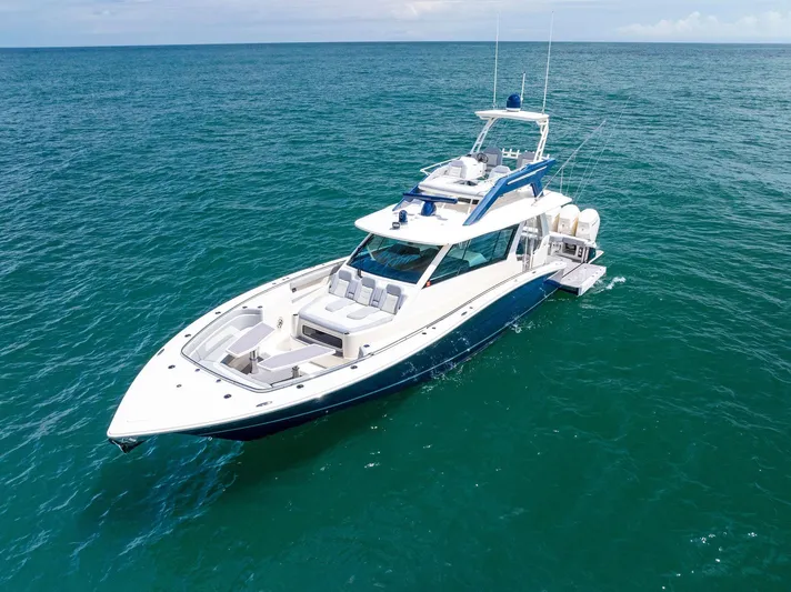 Bottom Line Yacht Photos Pics 2022 Scout LXF boat cruising on open ocean waters.