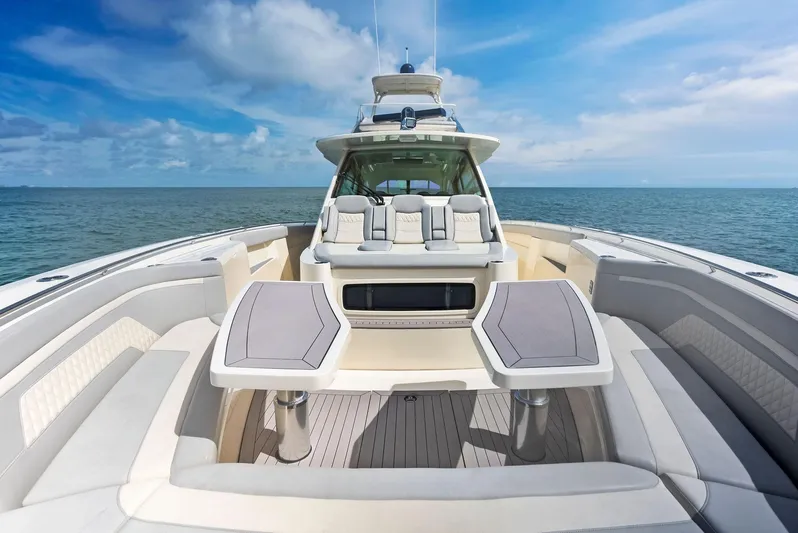 Bottom Line Yacht Photos Pics 2022 Scout LXF boat with luxurious seating on open water.