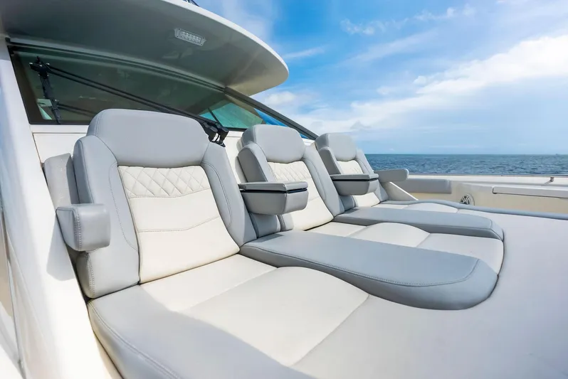 Bottom Line Yacht Photos Pics Luxurious seating on 2022 Scout LXF boat with ocean view.