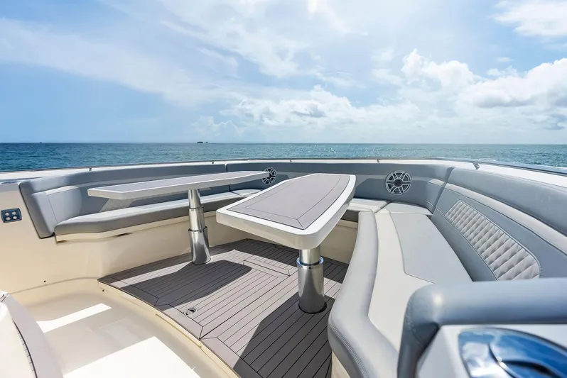 Bottom Line Yacht Photos Pics 2022 Scout LXF boat interior with luxurious seating and ocean view.