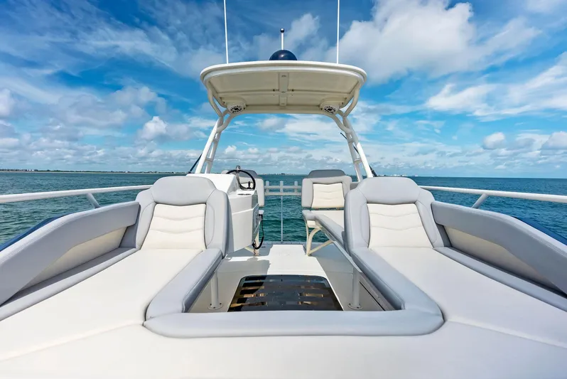 Bottom Line Yacht Photos Pics 2022 Scout LXF boat interior with luxurious seating and ocean view.