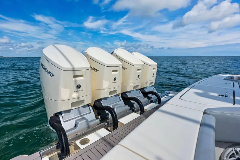 Bottom Line Yacht Photos Pics 2022 Scout LXF boat with four Mercury outboard engines on open water.