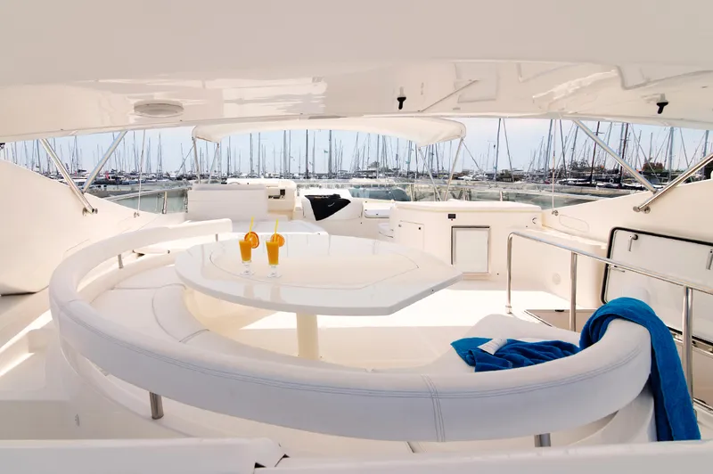  Yacht Photos Pics Luxurious 2003 Ferretti Yachts 760 with elegant seating and marina view.