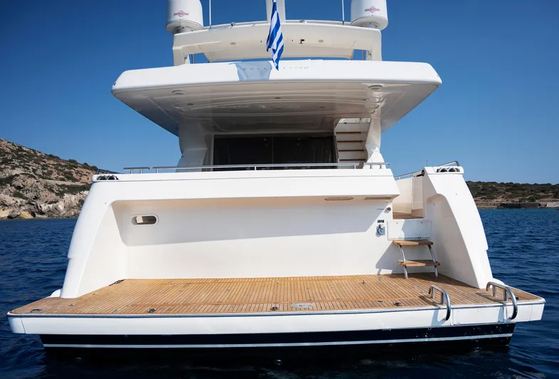  Yacht Photos Pics Rear view of 2003 Ferretti Yachts 760 on calm water, showcasing spacious deck.
