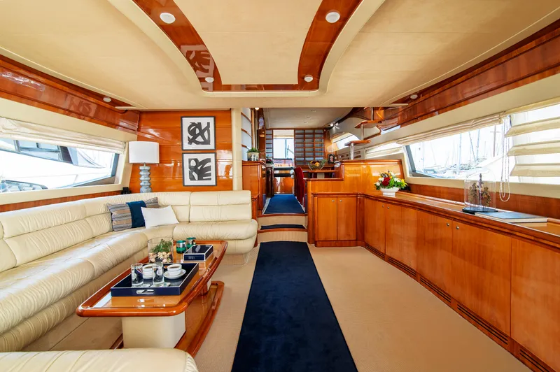  Yacht Photos Pics Luxurious interior of 2003 Ferretti Yachts 760 with elegant wood finishes and plush seating.