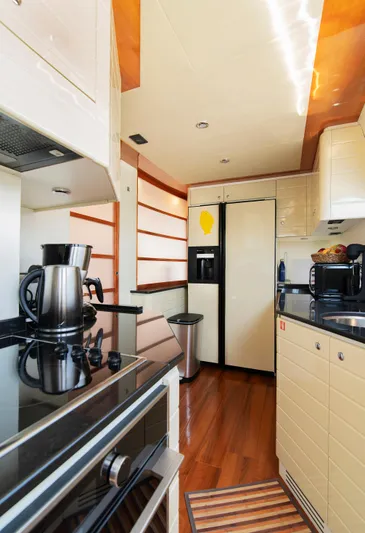  Yacht Photos Pics Luxurious kitchen interior of 2003 Ferretti Yachts 760 with modern appliances.