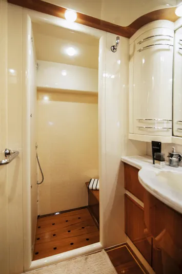  Yacht Photos Pics Luxurious bathroom interior of 2003 Ferretti Yachts 760 with elegant wood accents.