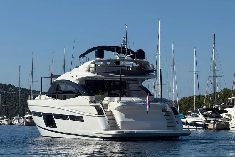  Yacht Photos Pics Luxury Princess V85 yacht from 2008 docked in a marina, surrounded by sailboats.