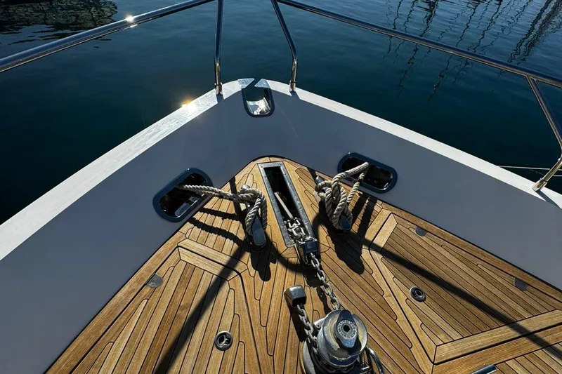  Yacht Photos Pics Bow of 2008 Princess V85 yacht with teak deck and anchor chain.