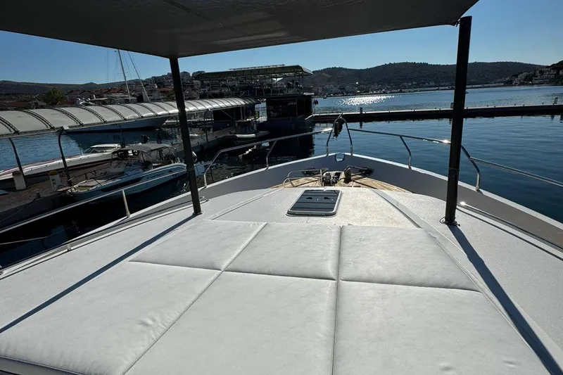  Yacht Photos Pics Luxurious 2008 Princess V85 yacht docked at a scenic marina under clear skies.