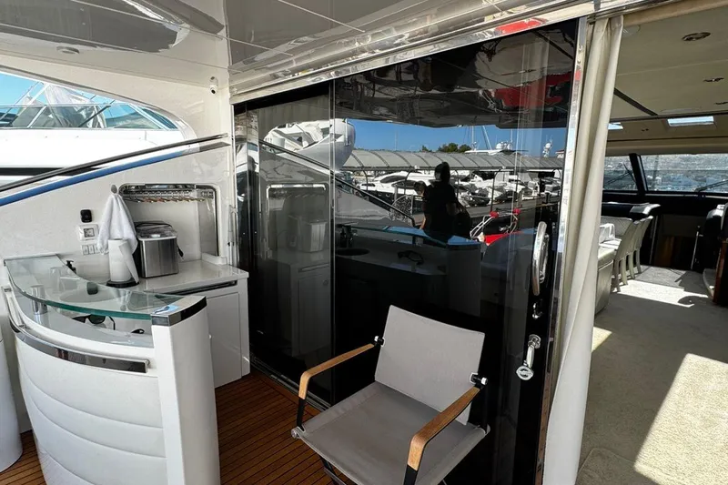  Yacht Photos Pics Luxurious 2008 Princess V85 yacht interior with modern bar and seating area.