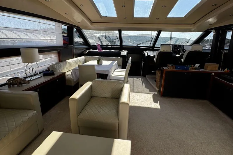  Yacht Photos Pics Luxurious interior of 2008 Princess V85 yacht with elegant seating and panoramic windows.