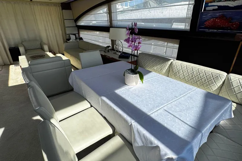  Yacht Photos Pics Luxurious interior of 2008 Princess V85 yacht with elegant dining area and orchid centerpiece.