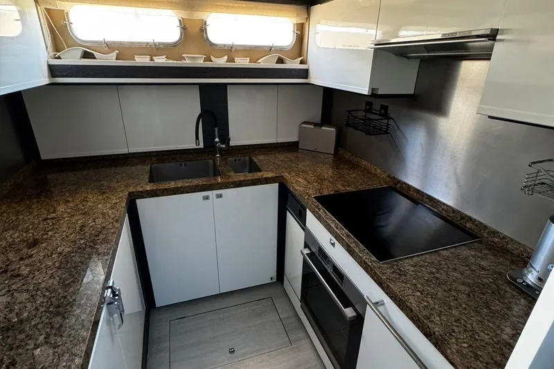  Yacht Photos Pics Luxurious kitchen in 2008 Princess V85 yacht with modern appliances and granite countertops.