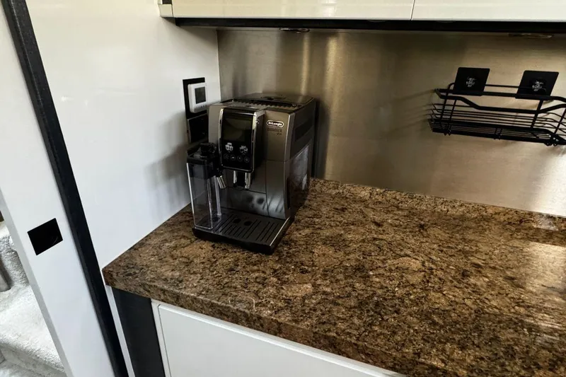  Yacht Photos Pics Coffee machine on granite countertop in a 2008 Princess V85 yacht kitchen.