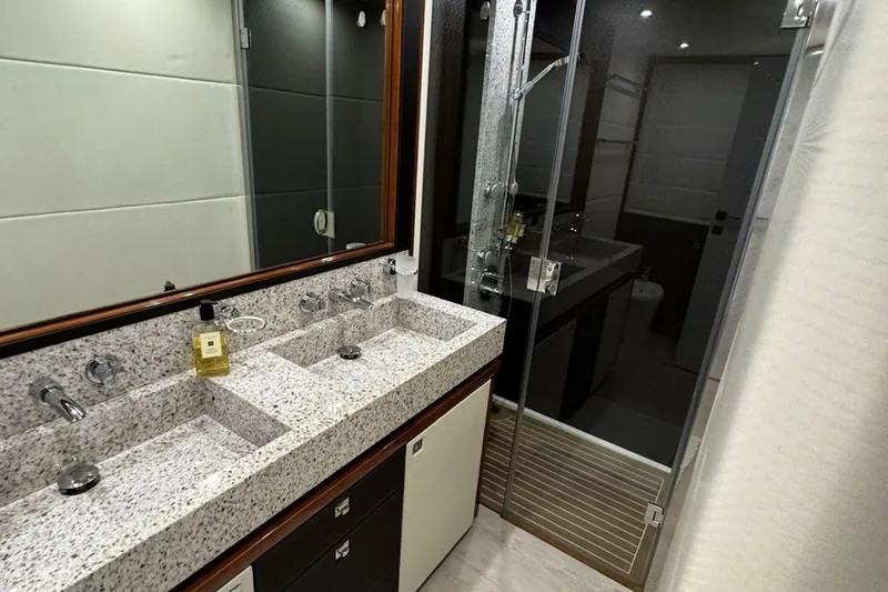  Yacht Photos Pics Luxurious bathroom in 2008 Princess V85 yacht with dual sinks and modern shower.