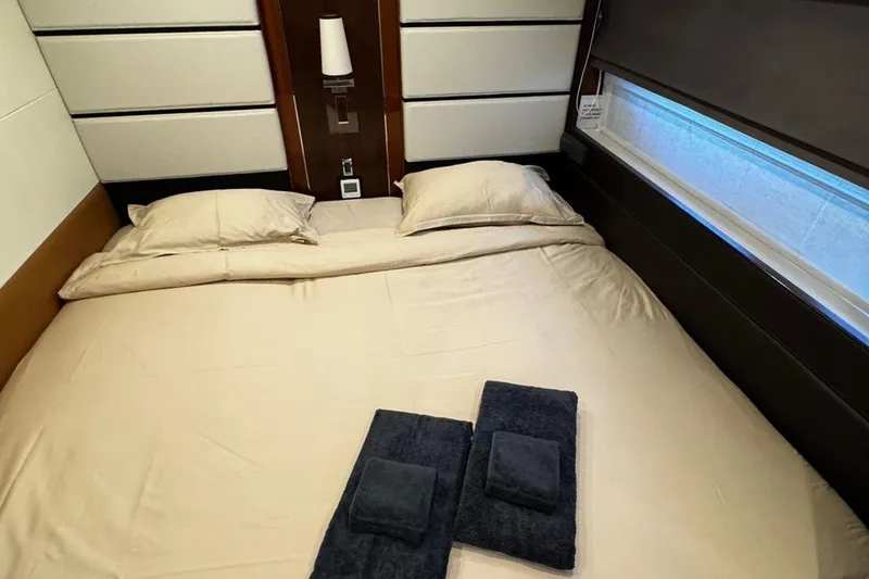  Yacht Photos Pics Luxurious bedroom interior of 2008 Princess V85 yacht with neatly arranged bed and towels.