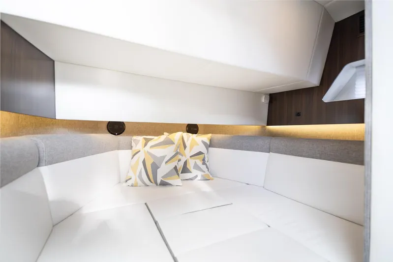  Yacht Photos Pics 2021 Cruisers Yachts 38 GLS interior cabin with modern design and geometric pillows.