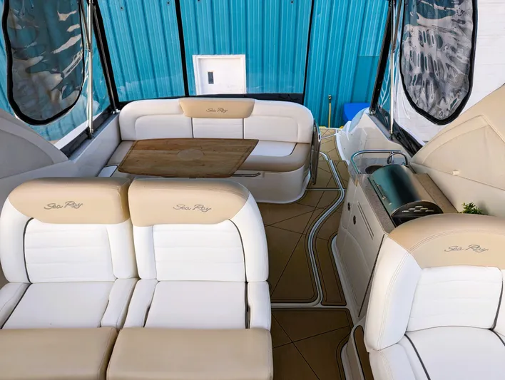  Yacht Photos Pics 2008 Sea Ray 330 Sundancer interior with beige seating and wooden table.