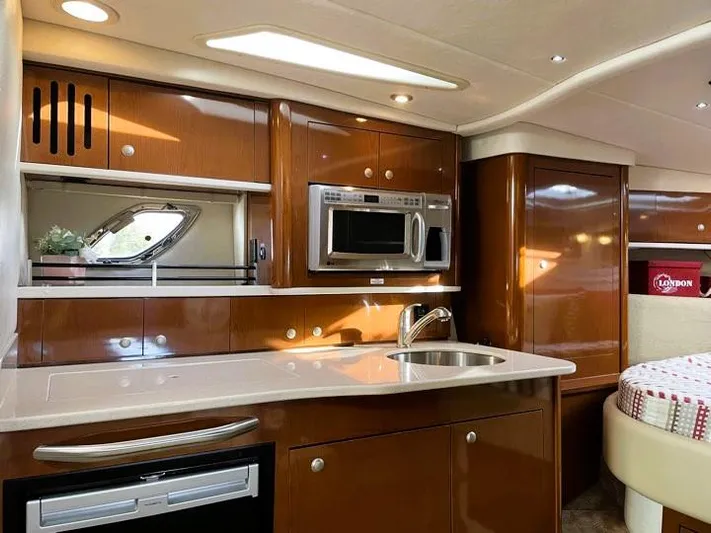  Yacht Photos Pics Luxurious 2008 Sea Ray 330 Sundancer yacht interior with modern kitchen amenities.