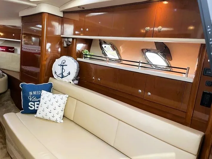  Yacht Photos Pics Interior of 2008 Sea Ray 330 Sundancer with beige seating and nautical-themed decor.