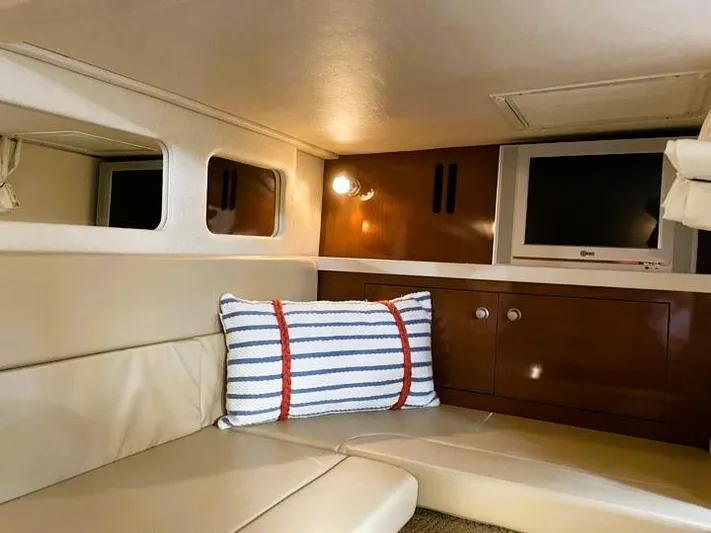  Yacht Photos Pics Interior cabin of 2008 Sea Ray 330 Sundancer with TV and striped pillow.