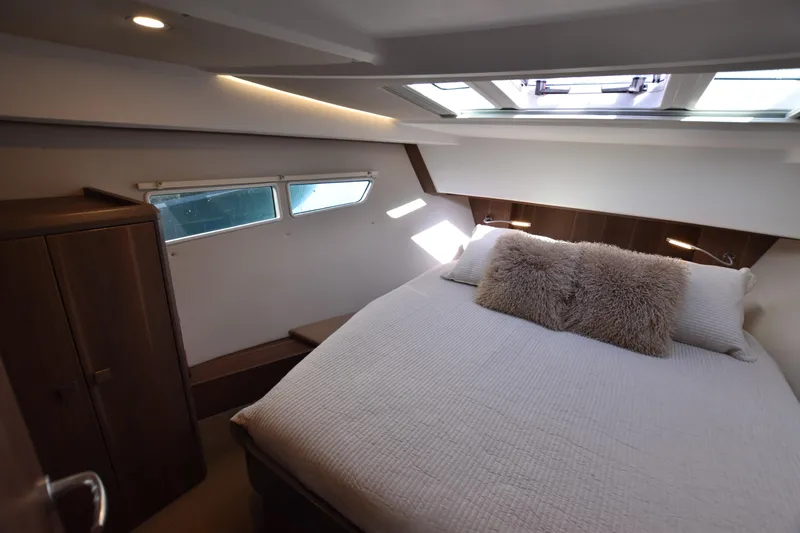 Indian Summer Yacht Photos Pics Luxurious cabin interior of 2016 Sealine C330 yacht with cozy bed and natural light.
