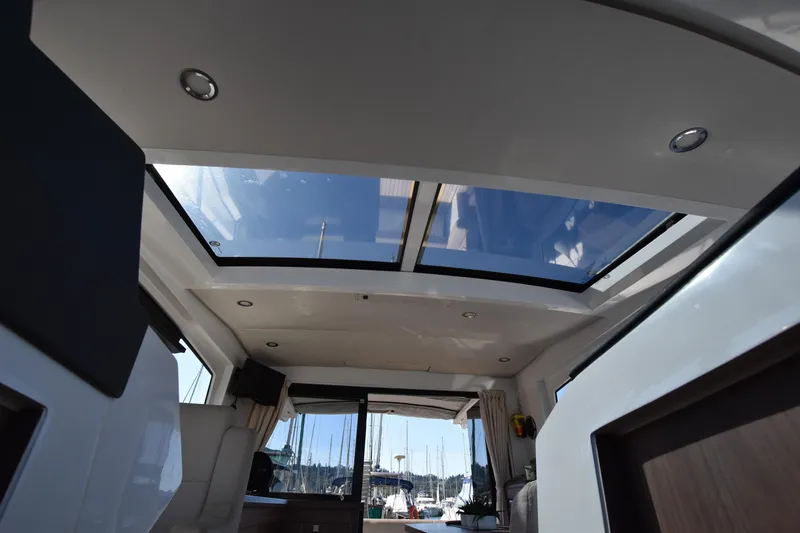 Indian Summer Yacht Photos Pics Interior view of 2016 Sealine C330 yacht with skylight and modern design.