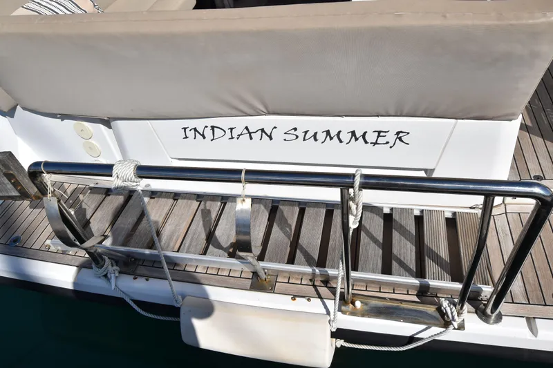 Indian Summer Yacht Photos Pics Sealine C330 2016 yacht named "Indian Summer" with wooden deck and metal railing.