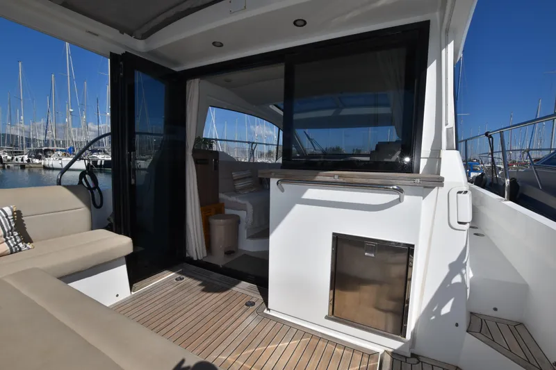 Indian Summer Yacht Photos Pics 2016 Sealine C330 yacht interior with open deck, marina view, and modern seating.