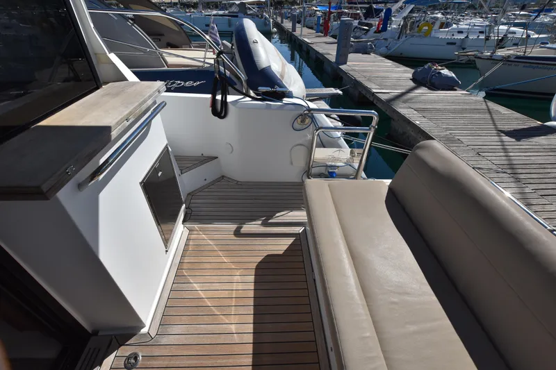 Indian Summer Yacht Photos Pics 2016 Sealine C330 yacht deck with seating and dock view.
