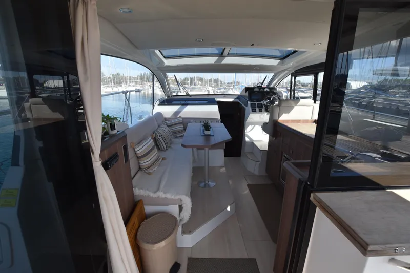 Indian Summer Yacht Photos Pics Interior of 2016 Sealine C330 yacht with modern seating and panoramic windows.
