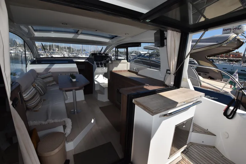 Indian Summer Yacht Photos Pics Interior of 2016 Sealine C330 yacht with modern design and marina view.