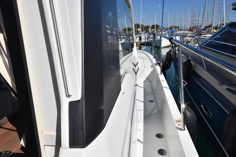 Indian Summer Yacht Photos Pics 2016 Sealine C330 yacht docked in a marina, showcasing sleek design and railings.