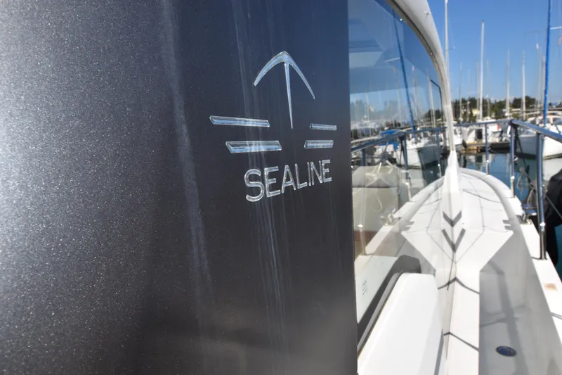 Indian Summer Yacht Photos Pics 2016 Sealine C330 yacht docked at marina, showcasing sleek design and logo.