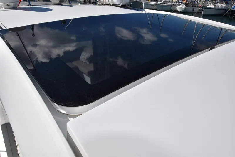 Indian Summer Yacht Photos Pics 2016 Sealine C330 yacht with sleek, reflective window and marina background.