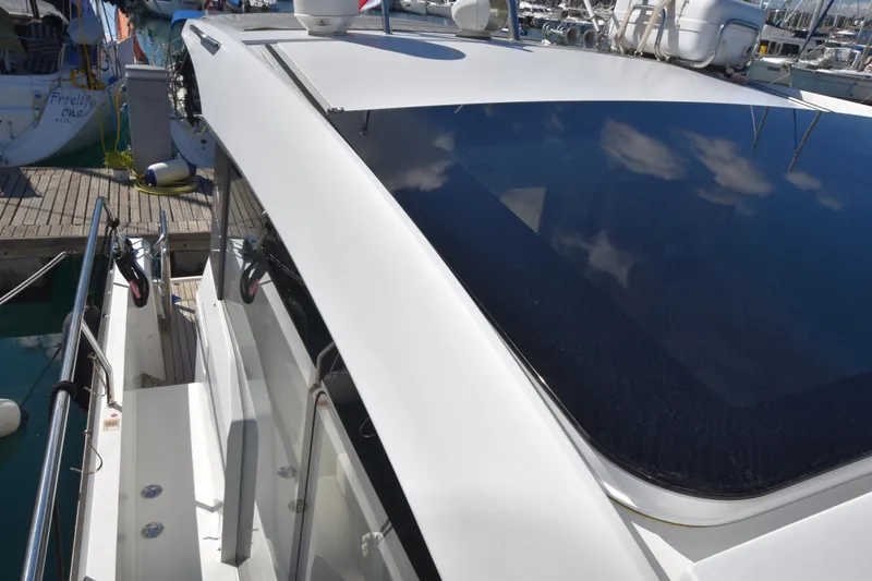 Indian Summer Yacht Photos Pics 2016 Sealine C330 yacht docked, showcasing sleek design and reflective windows.