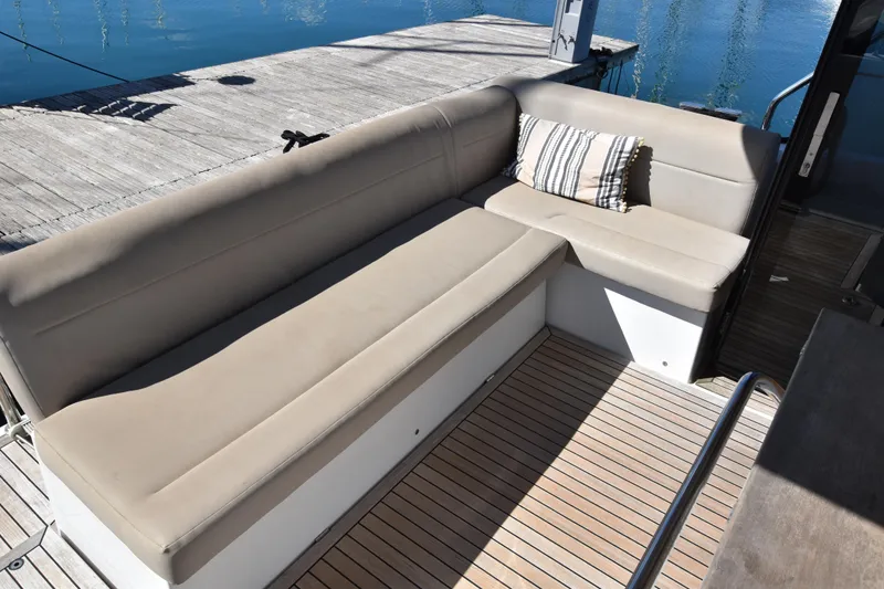 Indian Summer Yacht Photos Pics Luxurious seating area on 2016 Sealine C330 yacht with striped cushion.