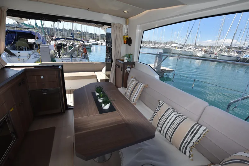 Indian Summer Yacht Photos Pics Interior of 2016 Sealine C330 yacht with elegant seating and marina view.