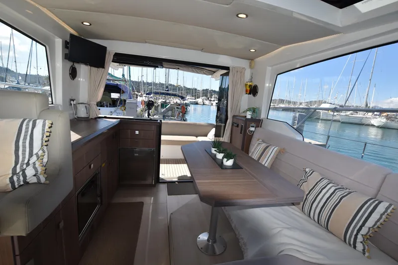Indian Summer Yacht Photos Pics Luxurious interior of 2016 Sealine C330 yacht with marina view.